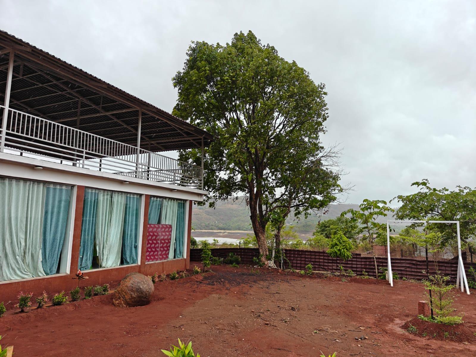 Aura Resort in its hillside setting near Bhor